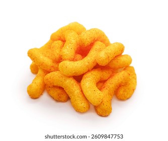 Puffed corn snacks, pile of cheese puffs isolated on white background. Cheese flavored puffed corn snacks isolated on white background. delicious cheesy puff snacks.