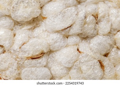 Puffed rice bread, ricecakes, background uniform texture, bunch in bulk close-up macro top view