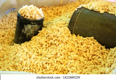 puffed rice is the main ingredient of  a street snack originating from the Bengal region of the Indian subcontinent, made of puffed rice and an assortment of spices, vegetables like chilly, onion, etc