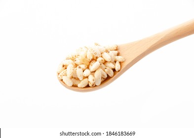 puffed rice on Wooden spoon white background