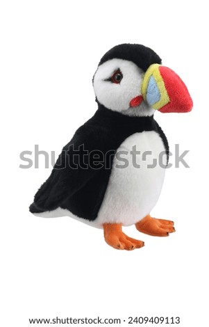puffin soft plush doll plaything for kids isolated on white background. child soft toys collection. top view character puppet. black and white puffin.