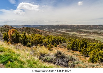 Puffy white clouds hang over the landscape of Wyoming. - Shutterstock ID 536843509