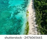 Puka Shell Beach. Clear turquoise water and ocean waves on sand. Boracay, Philippines.