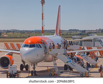 PULA, CROATIA - September 13 2019: The plane on the runway loads luggage and passengers before take-off