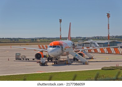 PULA, CROATIA - September 13 2019: The plane on the runway loads luggage and passengers before take-off