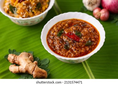 Puli Inji curry ginger pickle for Onam Sadhya Vishu vegetarian food on banana leaf. sweet and sour pickle made of ginger, tamarind, jaggery in Tamil Nadu, Kerala South India , Sri Lanka.