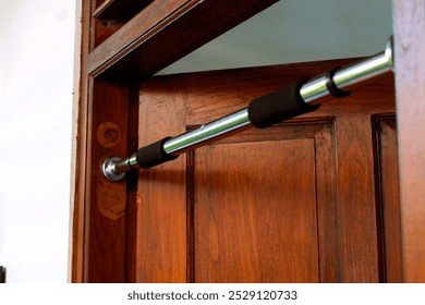 Pull up bar at a door