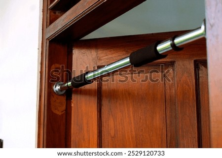 Pull up bar at a door
