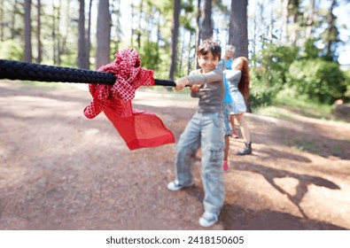 Pull. Children, game and tug of war in forest, summer camp and holiday with travel and energy outdoor. Kids, adventure and team building with competition, playful and young people in group for fun. - Powered by Shutterstock