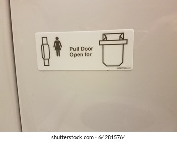 Pull Door Sign On Airplane Bathroom Door