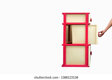 ็Hand pull the handle open Plastic drawer cabinet isolated on white background.
