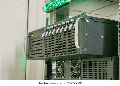 Pull out of the rack server close-up. Installing a large database server. The central computer contains many hard drives.