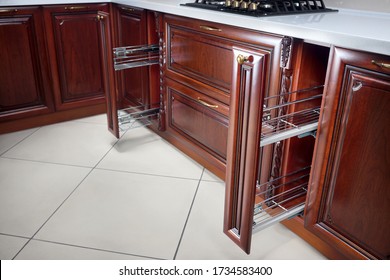 Pull Out Spice Rack Cabinet Filler Pantry. Two Vertical Drawers For Spices Shelf Under Countertop With Wooden Panel. Classic Style Interior Kitchen With Golden Elements Cherry Alder Wood Cabinetry.