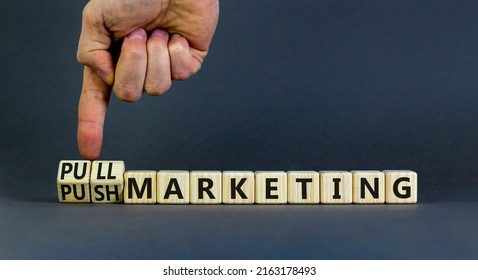 Pull or push marketing symbol. Businessman turns cubes and changes concept words Pull marketing to Push marketing. Beautiful grey background. Business and pull or push marketing concept. Copy space.