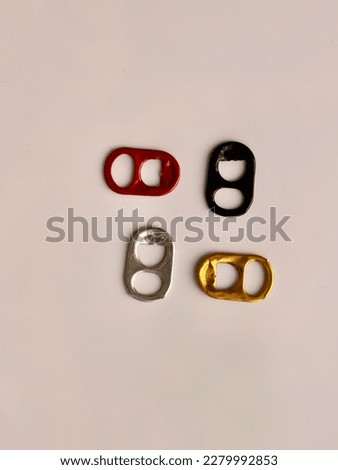 Pull ring tabs of soda or beer cans in different colors.