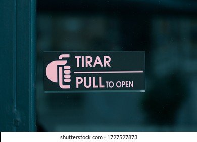 Pull Sign On Glass Door, Written In English And Spanish