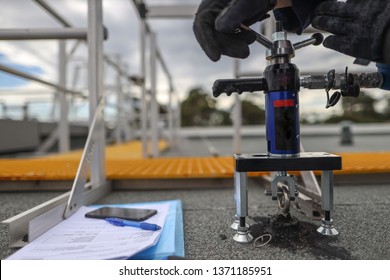 Pull Testing Strength Of Roof Anchor Point Prior To Used Abseiling Sydney CBD, Australia  