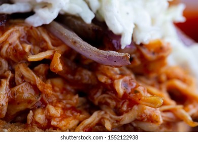 Pulled BBQ Chicken Closeup W/ Onion And Coleslaw