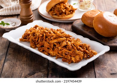 Pulled Bbq Chicken On A Serving Plate With Brioche Buns Ready To Making Sandwiches