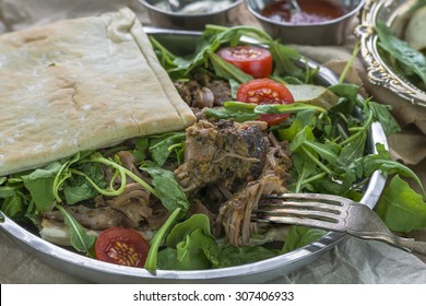 Pulled Lamb With Fresh Rocket Salad And Pitta Bread