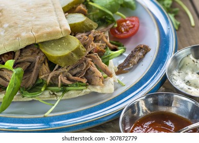 Pulled Lamb With Fresh Rocket Salad And Pitta Bread