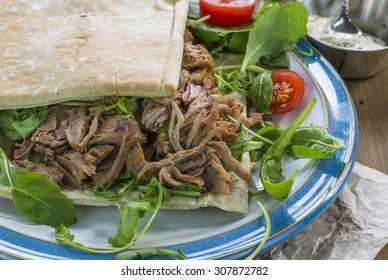 Pulled Lamb With Fresh Rocket Salad And Pitta Bread