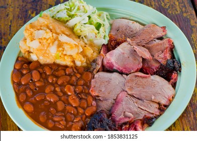 Pulled Pork. Barbecue Pork Platter Served With Classic Bbq Sides Mac N Cheese, Cornbread, Brussels Sprouts, Coleslaw And Beer. Classic Traditional Texas Meats And Side Dishes.