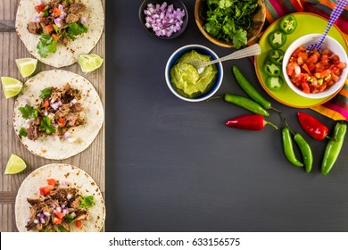 Pulled Pork Carnitas With Pico De Gallo On A Flour Tortilla.