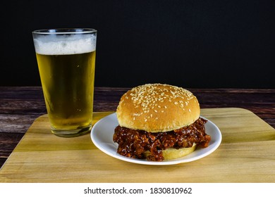 Pulled Pork Sandwich With Beer On A Cutting Board