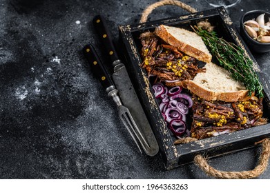 Pulled Pork Sandwich With Smoked Pork Meat In A Wooden Tray. Black Background. Top View. Copy Space