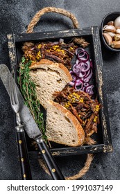 Pulled Pork Sandwich With Smoked Pork Meat In A Wooden Tray. Black Background. Top View