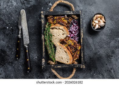 Pulled Pork Sandwich With Smoked Pork Meat In A Wooden Tray. Black Background. Top View