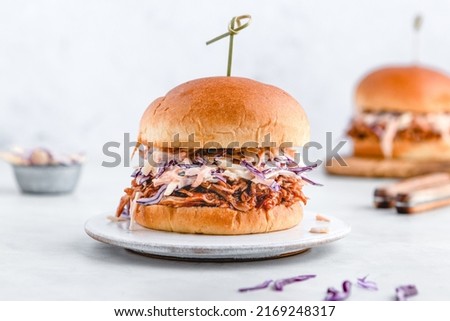 Pulled pork sliders with coleslaw, buns and seasoning. Pulled pork burgers. 