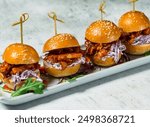 Pulled Pork Sliders or mini burger served in dish isolated on background side view of italian food