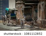 Pulled Rickshaw or Ricksha a human-powered transport parked on sidewalk, Kolkata, India.