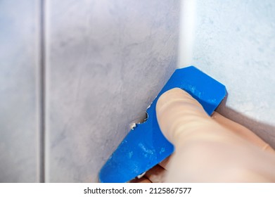 Pulling Off A Silicone Joint With A Joint Puller In The Bathroom