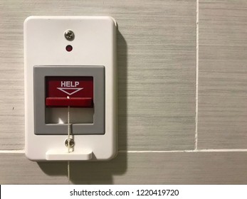 Pulling of red emergency call alert in the hospital toilet