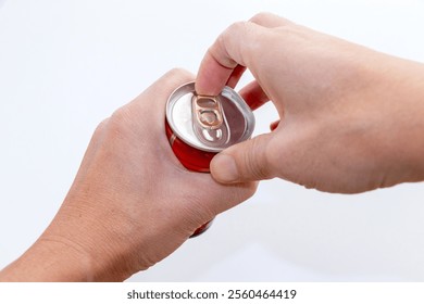 Pulling the tab on a can of drink