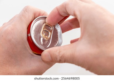 Pulling the tab on a can of drink
