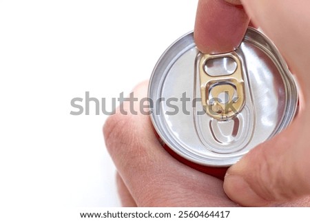 Pulling the tab on a can of drink