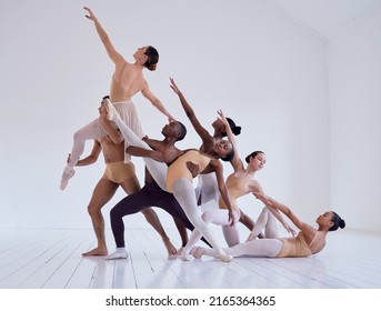 Pulling together to create beauty. Shot of a group of ballet dancers practicing a routine in a dance studio. - Powered by Shutterstock