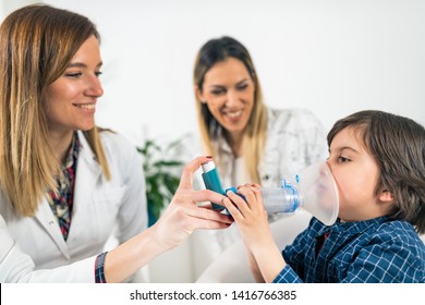 Pulmonology Doctor Helping Little Boy With Inhaler