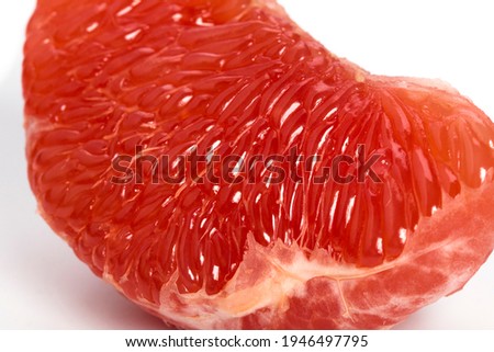 The pulp of a red grapefruit close-up. Closeup. Grapefruit fibers in high magnification.