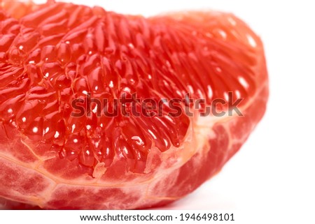 The pulp of a red grapefruit close-up. Closeup. Grapefruit fibers in high magnification.