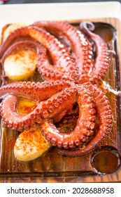 Pulpo Gallego -  Whole Galician Octopus. Cooked Octopus Served With Potatoes And Paprika