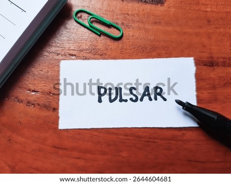 Pulsar writting on table background.