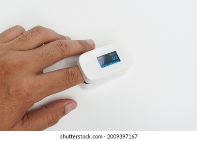 Pulse oximeter used to measure pulse rate and oxygen levels                                - Shutterstock ID 2009397167