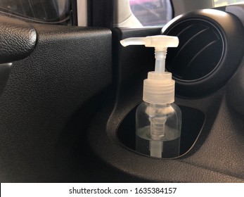 Pump Bottle Of Hand Sanitizer Placed In A Car’s Cup Holder. Kill Germs, Viruses And Bacteria While Traveling.