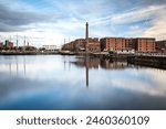 The Pump House pub and Albert Dock buildings reflected in a still Canning Dock, Liverpool, Merseyside, England, United Kingdom, Europe