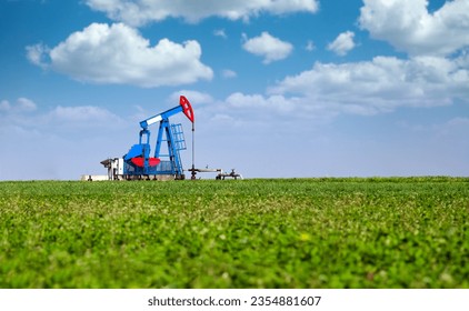 Pump jack on field oil industry landscape - Powered by Shutterstock